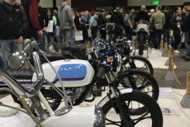 Bikes are lined up while show goers eye the large vintage selection shown at the event | Haley Nelson