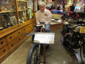 Mike Wilson sits atop Leo Payne's Sportster that Mike and his wife, Margaret, have on loan to the museum