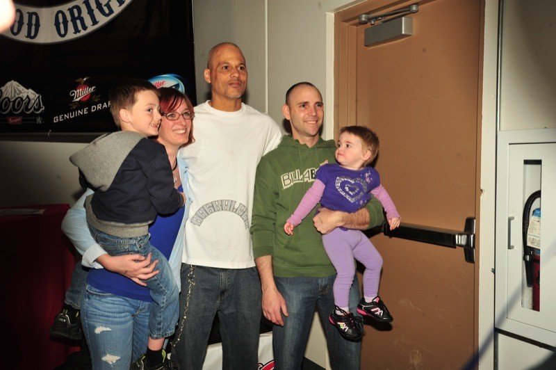 "Happy" poses with a family of fans in Colorado Springs