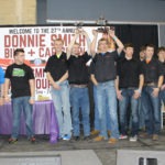 The MTI club onstage accepting awards from Donnie Smith