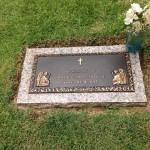 Memorial for Elvis' stillborn twin brother Jessie is placed next to the graves of Elvis, his parents and grandmother