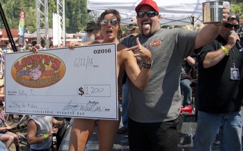 Classy lass Holly got the big check for showing off her big… assets