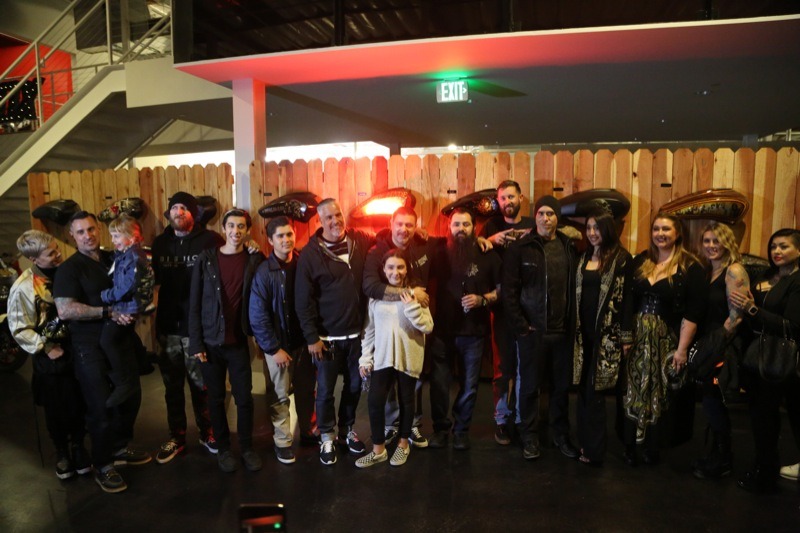 Carey Hart, along with his wife Pink and daughter Willow join friends and contributors for a group photo towards the end of the evening