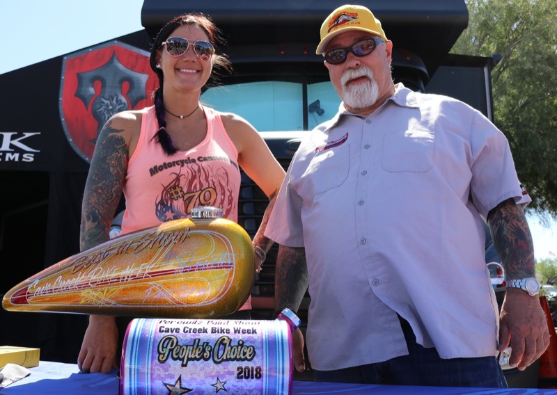 Father/daughter painters Jodi and Dave Perewitz hosted a paint contest on Saturday at the Road House with hand built awards. Jodi’s custom paint work adorned the purple People’s Choice tank (foreground), with Dave’s handiwork gracing the Best of Show yellow tank.