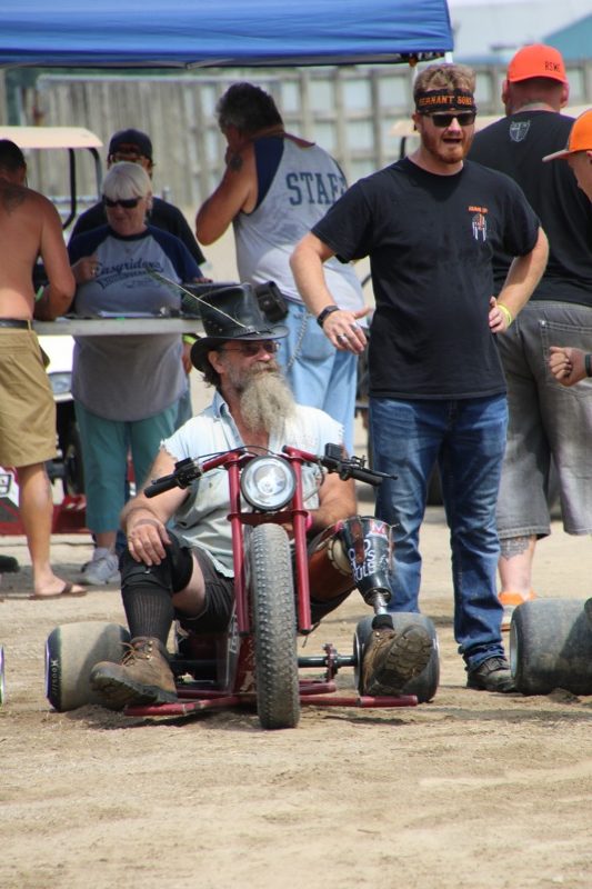 Herold Renyolds that is known for competing in the barrel races (and doing quite well with one prosthetic leg) gearing up for a round of drift trike racing