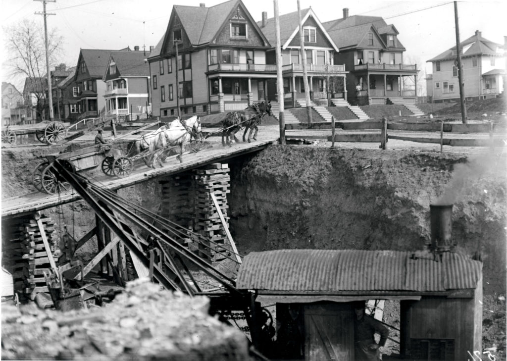 Excavation work and a makeshift bridge for the factory addition at 37th and Juneau, circa 1912.
