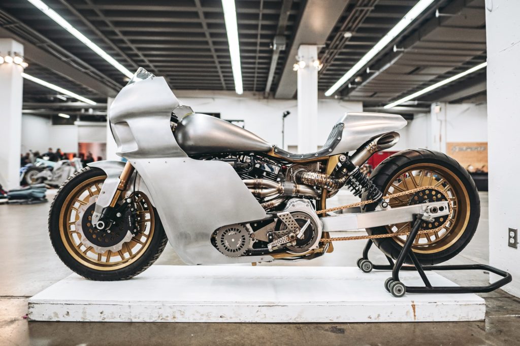 Built by Royal-T Racing out of New Orleans, this bike wasn’t just one of the most talked about builds from The One, it won the prestigious The One Show award. Roland Sands called it “art, performance, and function smashed into one.” It began its life as a Harley Dyna, and unique details like extended aluminum full fairing lowers and extended swingarm made this badass build a show favorite. 