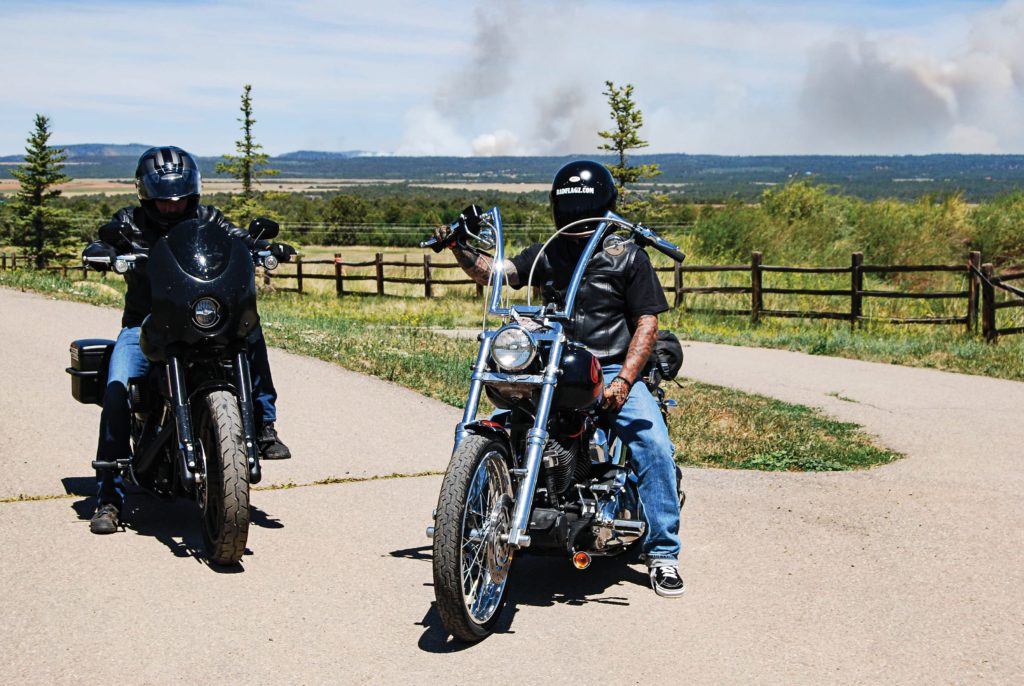 Dave Roe from V-Twin Visionary on the 2020 Low Rider S and Kent Prentiss of Radflagz on his custom chopper outside of Durango, Colorado.  A sign of the times with a forest fire burning in the background. 