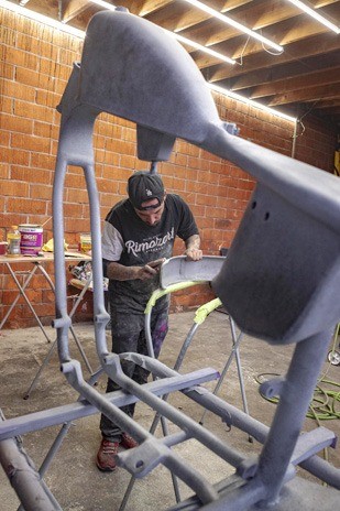 Rimo works on the frame, gas tank, and fenders of the chopper that Jonny Suarez was building for the Valadez family as a tribute to Gypsy Rose.